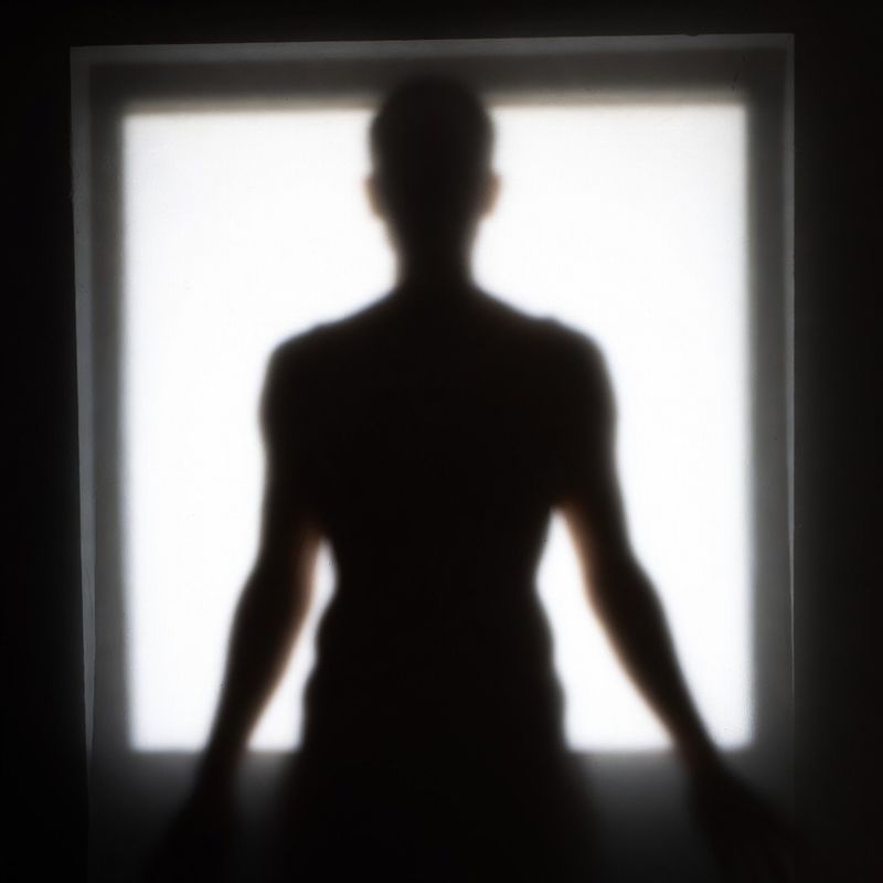 photos-people-editorial-portraits · Silhouette Against Bright Window
